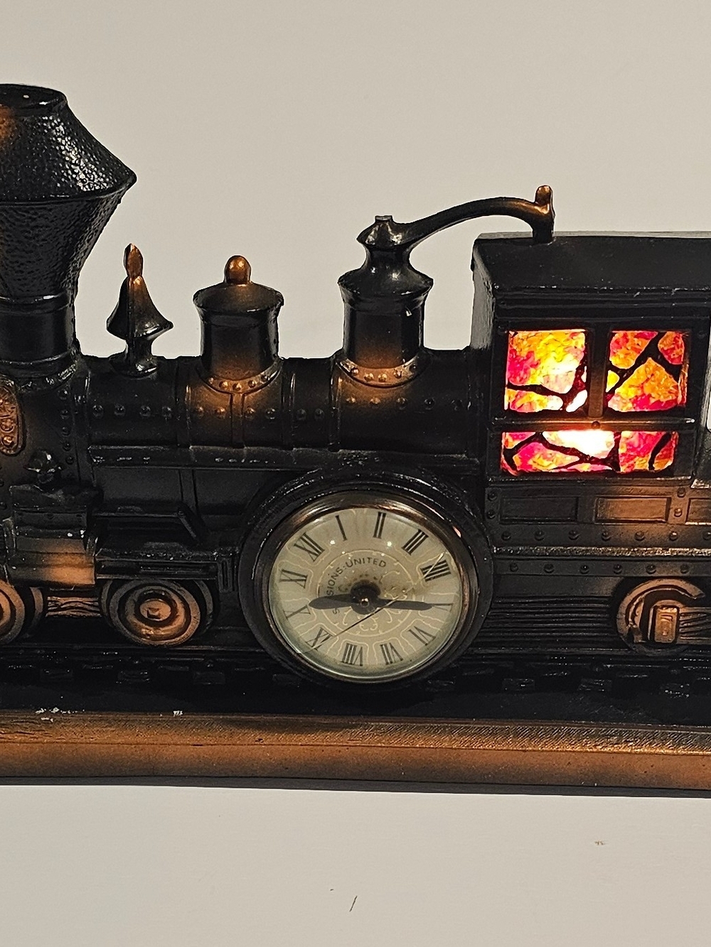 United Metal Train Clock Black and Cooper with Stained-Glass Window